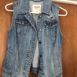 Distressed denim vest
